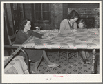 Quilting in sharecropper's home near Pace, Mississippi. Background photo for Sunflower Plantation