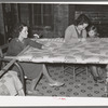 Quilting in sharecropper's home near Pace, Mississippi. Background photo for Sunflower Plantation