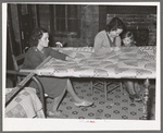 Quilting in sharecropper's home near Pace, Mississippi. Background photo for Sunflower Plantation
