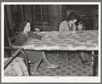 Quilting in sharecropper's home near Pace, Mississippi. Background photo for Sunflower Plantation