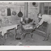 Home of share-cropper living near Merigold, Mississippi. Background photo, Sunflower Plantation