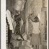 Goods piled in corner of living room of sharecropper near Merigold, Mississippi. Background photo, Sunflower Plantation