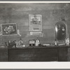 Decorations above mantelpiece in farm home near Merigold, Mississippi. Background photo for Sunflower Plantation