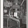 Cans are fed by gravity to a sterilizer and they are then filled in a rotary machine at the grapefruit juice canning plant. Weslaco, Texas