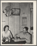 FSA client and wife noting farm income in ledger. Hidalgo County, Texas