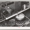 Canning machine. Grapefruit juice cannery, Weslaco, Texas