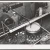 Canning machine. Grapefruit juice cannery, Weslaco, Texas