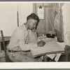 Mexican labor contractor working on his books. Robstown, Texas