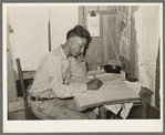 Mexican labor contractor working on his books. Robstown, Texas