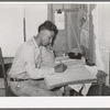 Mexican labor contractor working on his books. Robstown, Texas