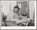 Mexican labor contractor working on his books. Robstown, Texas