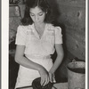 Mexican girl grinding peppers. Robstown, Texas