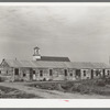 Mexican housing at Edcouch, Texas. Notice church in background