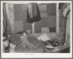 Interior of tent of white migrant family near Edinburg, Texas. Bed is on the floor. Tent was made of patched cotton materials of various sorts. The man said he had worked in a cotton mill in Dallas, Texas, and had obtained the materials then