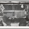 Sick child in bed in trailer home. Sebastian, Texas