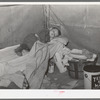 Child with measles in tent home of his migrant parents. Edinburg, Texas