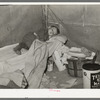 Child with measles in tent home of his migrant parents. Edinburg, Texas