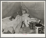 Child with measles in tent home of his migrant parents. Edinburg, Texas