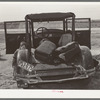 Car of white migrant worker being repaired by owner near Harlingen, Texas