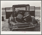 Car of white migrant worker being repaired by owner near Harlingen, Texas