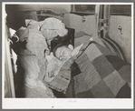 White migrant boy asleep in car. He came with his father from Houston to Edinburg, Texas