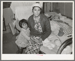 Mexican mother and child in home. Crystal City, Texas. This woman had given birth to baby on bed while she had an advanced case of gonorrhea. The baby at time picture was taken was ten days old