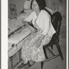 Mexican woman in bedroom. Notice the dirt floor. Crystal City, Texas