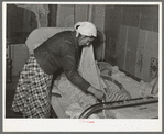 Mexican mother covering sleeping child. Crystal City, Texas