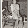 Mexican child with dried beans which play a large part in the Mexican diet. Crystal City, Texas