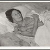 Mexican woman with advanced case of arthritis. She has been confined to bed for several years. Crystal City, Texas