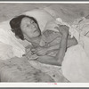 Mexican woman with advanced case of arthritis. She has been confined to bed for several years. Crystal City, Texas