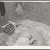 Bed in Mexican home. In practically all Mexican homes the beds consist of old blankets and quilts that are spread upon the bare floors. Crystal City, Texas
