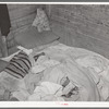 Bed in Mexican home. In practically all Mexican homes the beds consist of old blankets and quilts that are spread upon the bare floors. Crystal City, Texas