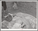 Bed in Mexican home. In practically all Mexican homes the beds consist of old blankets and quilts that are spread upon the bare floors. Crystal City, Texas