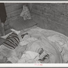 Bed in Mexican home. In practically all Mexican homes the beds consist of old blankets and quilts that are spread upon the bare floors. Crystal City, Texas