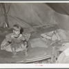 Child of white migrant in tent home. Corpus Christi, Texas