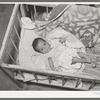 Mexican baby. This child is suffering from malnutrition. Notice the legs and arms. Crystal City, Texas