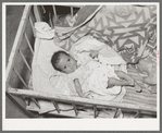 Mexican baby. This child is suffering from malnutrition. Notice the legs and arms. Crystal City, Texas