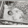 Mexican baby. This child is suffering from malnutrition. Notice the legs and arms. Crystal City, Texas