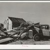 Abandoned automobile and wrecked house. Crystal City, Texas. Mexican section