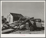 Abandoned automobile and wrecked house. Crystal City, Texas. Mexican section