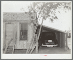 House, garage and new car of Mexican. Crystal City, Texas. It is common practice for the Mexicans on returning from the beet fields of Minnesota and North Dakota and Colorado to make first payments on cars