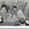 Mexican children in kitchen. San Antonio, Texas