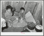 Mexican children in kitchen. San Antonio, Texas