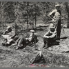 Lumberjacks resting by roadside near Littlefork, Minnesota