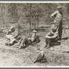 Lumberjacks resting by roadside near Littlefork, Minnesota