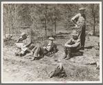 Lumberjacks resting by roadside near Littlefork, Minnesota