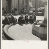 Unemployed men sitting in public square in the Minneapolis "Gateway" district, Minnesota