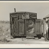 Tarpaper dwelling of man living in abandoned lumber camp, Gemmel, Minnesota