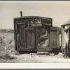 Tarpaper dwelling of man living in abandoned lumber camp, Gemmel, Minnesota